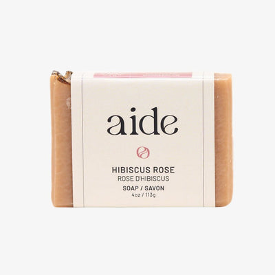 Bar of soap with 'aide' branding on a white background