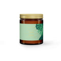 Jar with a green label and gold lid on a white background
