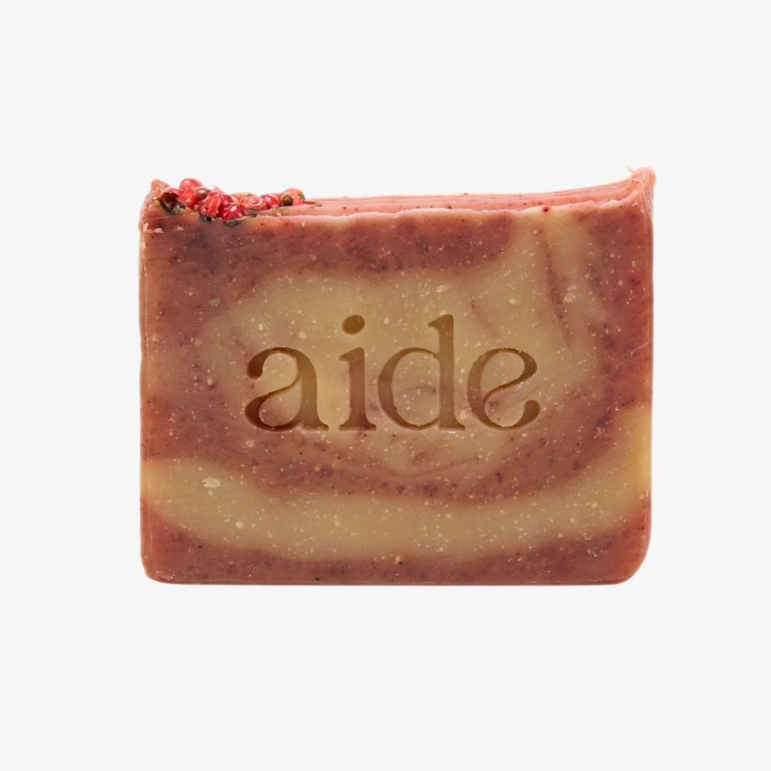 Bar of soap with 'aide' branding on a white background