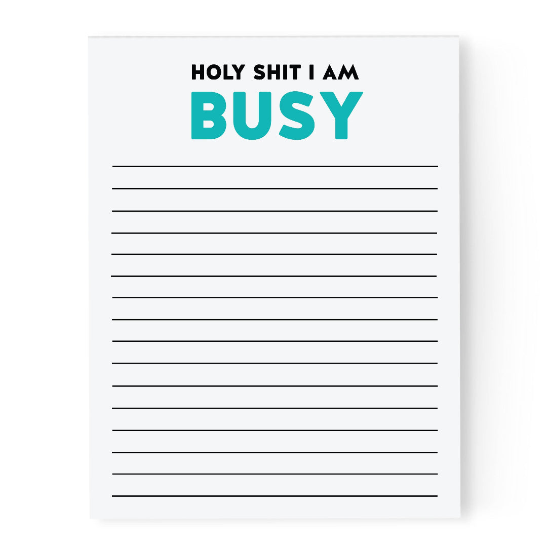 Notepad with text 'HOLY SHIT I AM BUSY' in black and teal on a white background