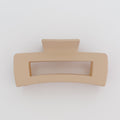 Beige hair clip on a white background