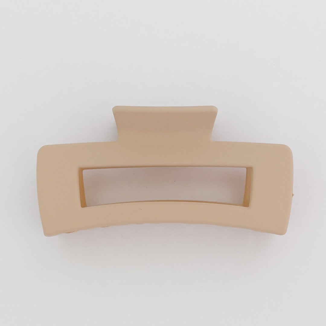Beige hair clip on a white background
