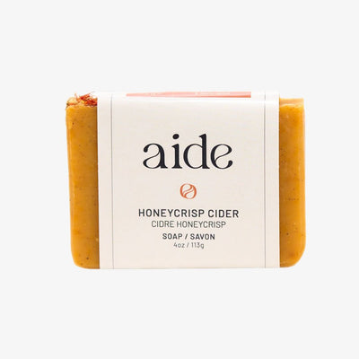 Bar of soap with 'aide' branding on a white background
