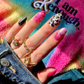 A sheet of cowboy-themed nail art stickers. The sheet is purple and has the brand name "Deco Beauty" printed on it. There's a section titled "Howdy" and instructions on how to apply the stickers. The stickers include various cowboy-themed designs like boots, horseshoes, stars, and butterflies.