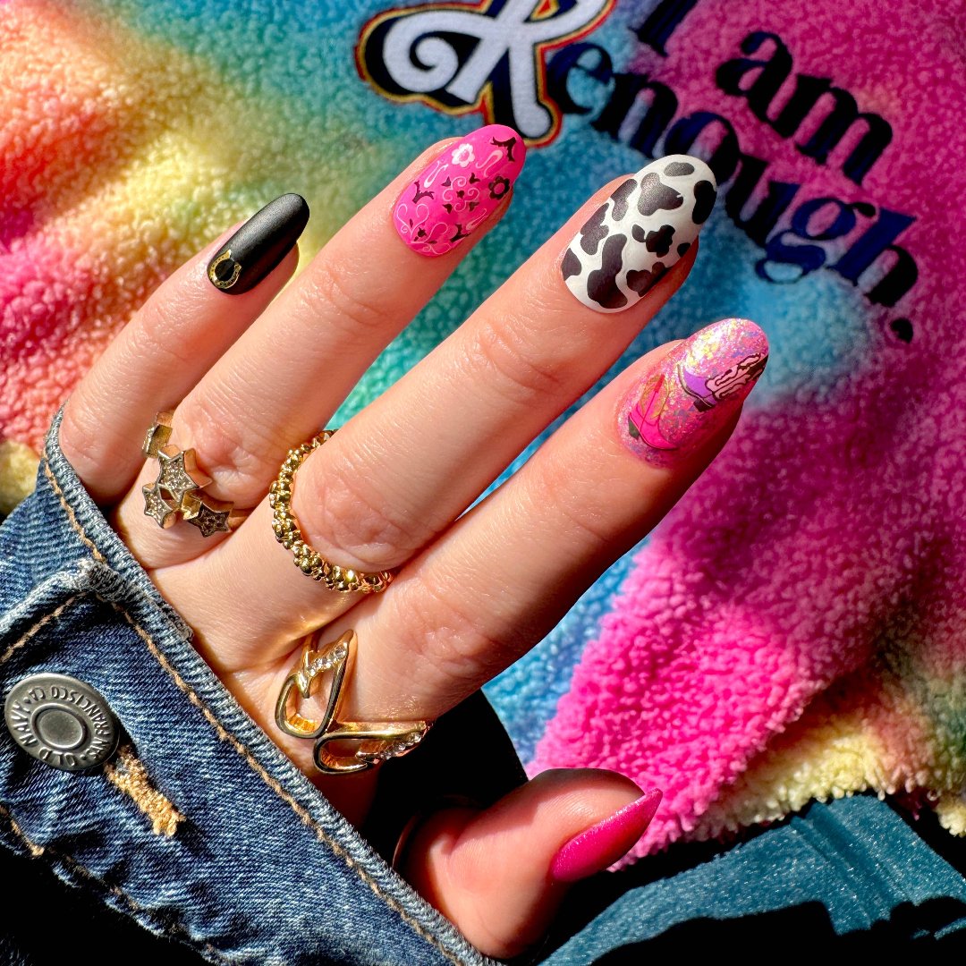 A sheet of cowboy-themed nail art stickers. The sheet is purple and has the brand name "Deco Beauty" printed on it. There's a section titled "Howdy" and instructions on how to apply the stickers. The stickers include various cowboy-themed designs like boots, horseshoes, stars, and butterflies.
