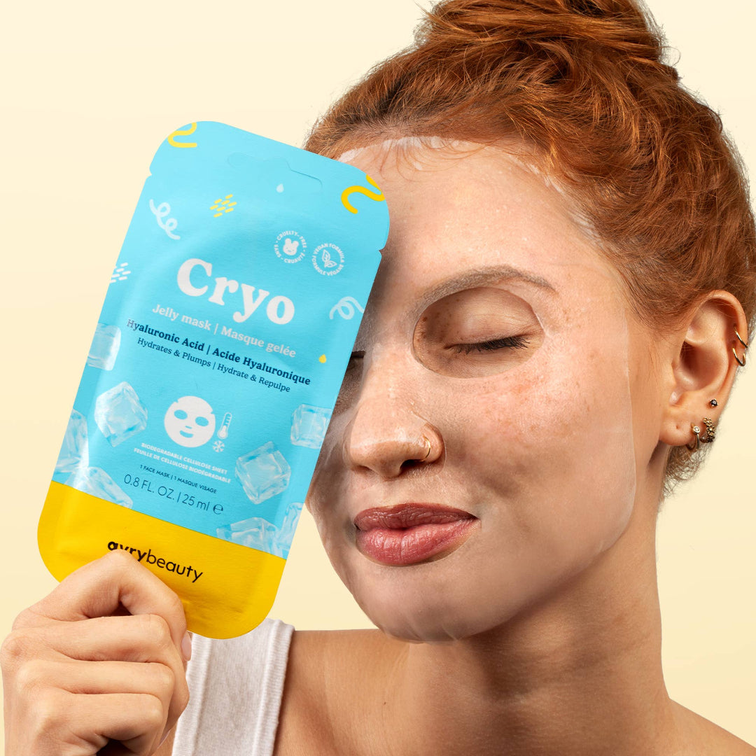 Woman holding a Cryo beauty mask against a beige background