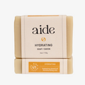 A bar of hydrating soap with the brand name 'aide' printed on the packaging, indicating it is vegan and cruelty-free.