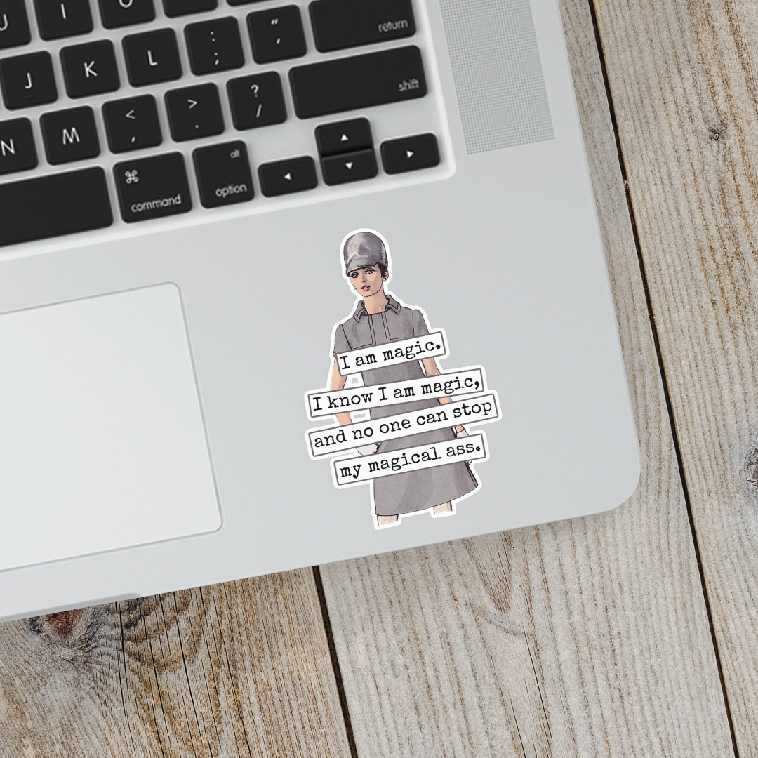 Laptop with a sticker of a person in a suit and text on a wooden surface