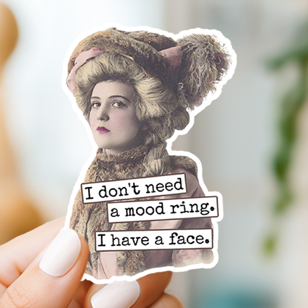 Vintage-style sticker with text 'I don't need a mood ring. I have a face.' held by a hand.