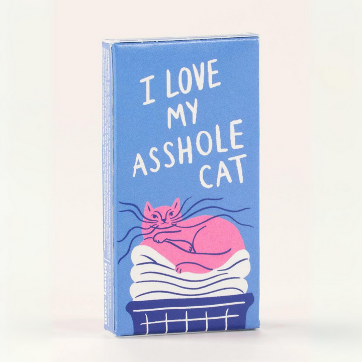 A box of gum with a playful and humorous design. The box is blue with a pink cat lounging on a cloud. The text on the box reads, 