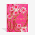 Greeting card with pink and white floral design on a pink background