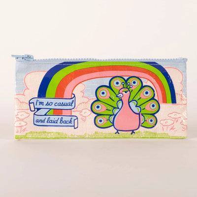 A rectangular light blue pencil case with a zipper, featuring a whimsical illustration of a pink peacock with an outstretched rainbow tail feathers. Above the peacock is a rainbow arc and a banner with the text 