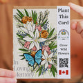 Plantable card with floral design and butterfly, held by a person.