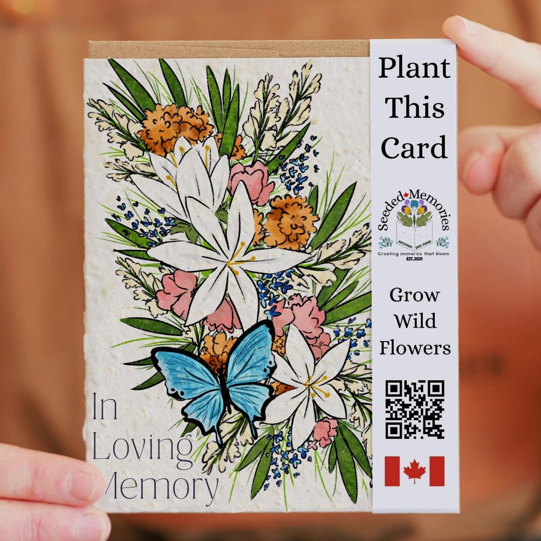 Plantable card with floral design and butterfly, held by a person.