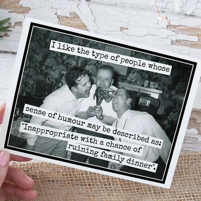 Black and white photo of two men eating pizza with humorous text overlay on a textured surface.