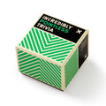 Hexagonal trivia cube with green and beige pattern on a white background