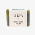 Bar of soap with 'aide' branding on a white background