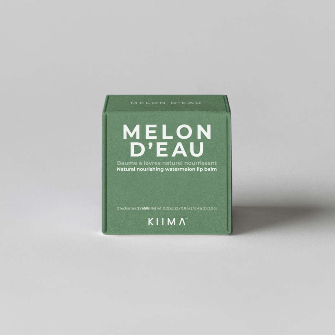 Green box of Melon d'Eau soap on a gray background