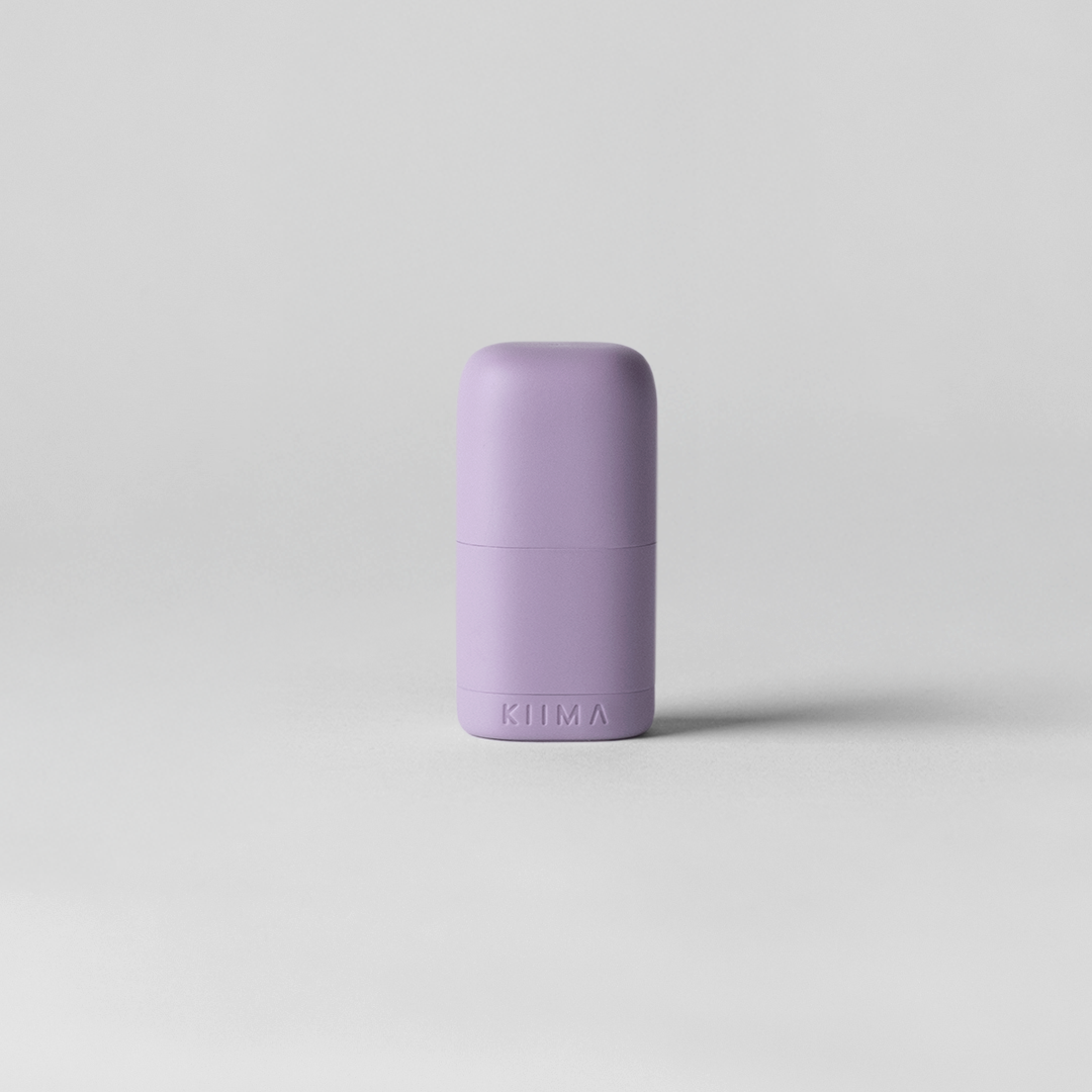 Purple cylindrical object on a light gray background