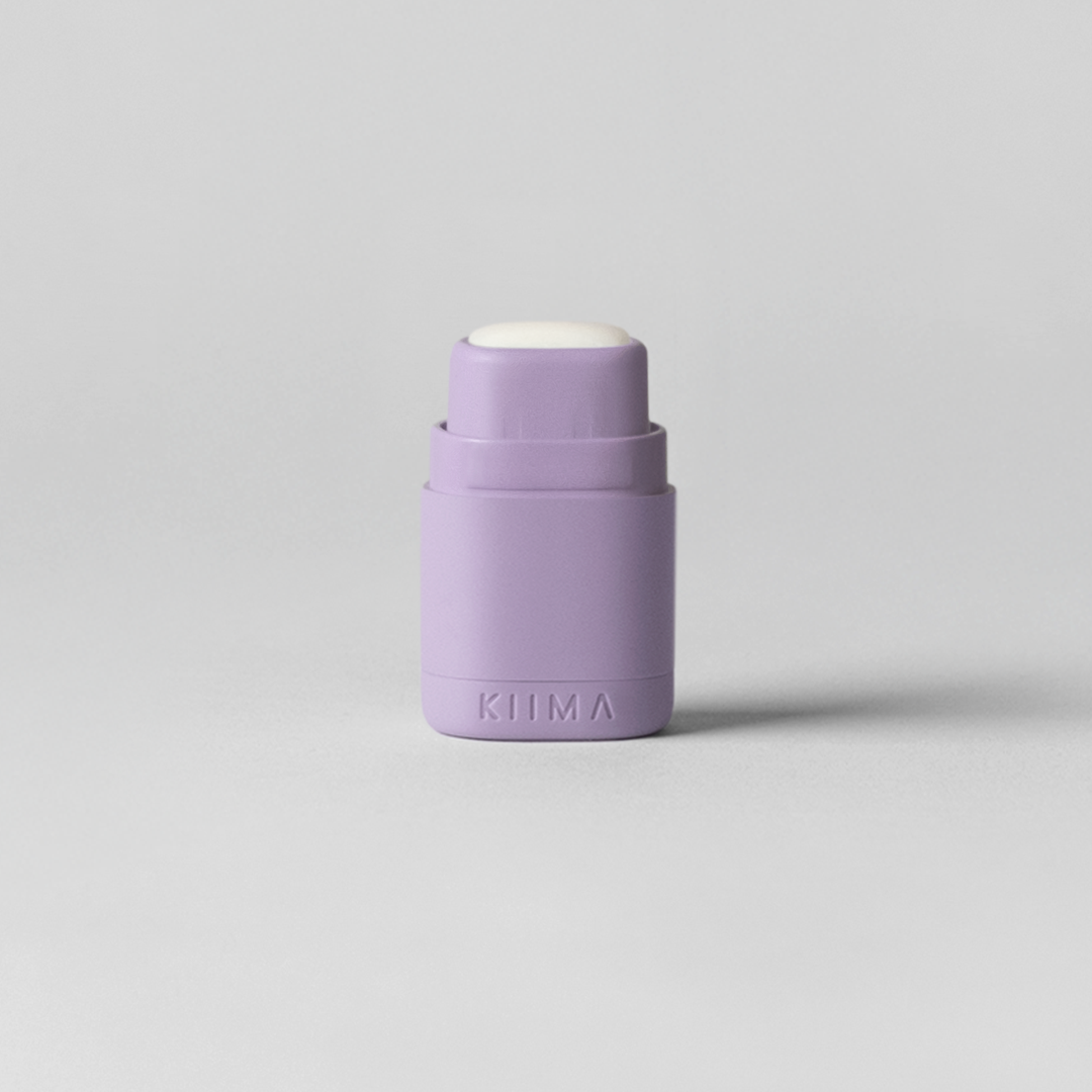Purple cylindrical container on a light gray background