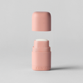 Two pink cylindrical containers on a light gray background