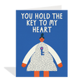 Greeting card with illustration of a person holding a key and text 'You hold the key to my heart' on a blue background.