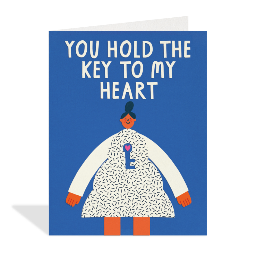 Greeting card with illustration of a person holding a key and text 'You hold the key to my heart' on a blue background.