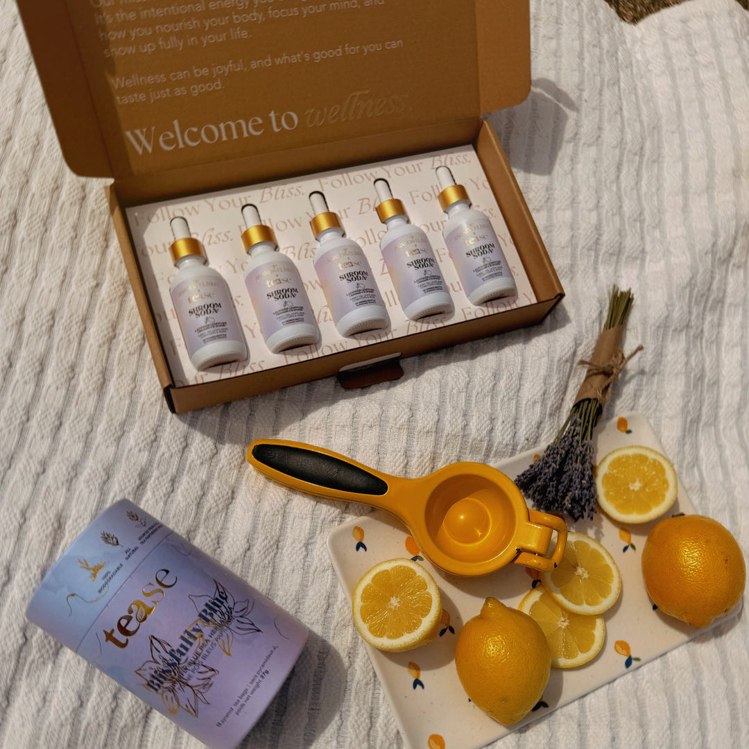 Wellness product set with lemons and a tea bag on a textured surface