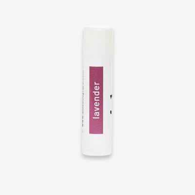 A white tube of lip balm with the word 