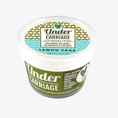 Under Carriage deodorant cream jar with green and white label on a white background