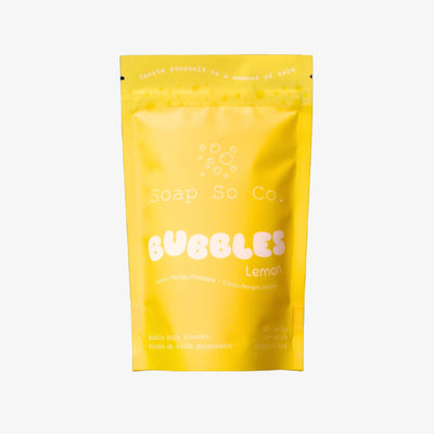 Yellow package of Soap Co. Bubbles Lemon on a black background