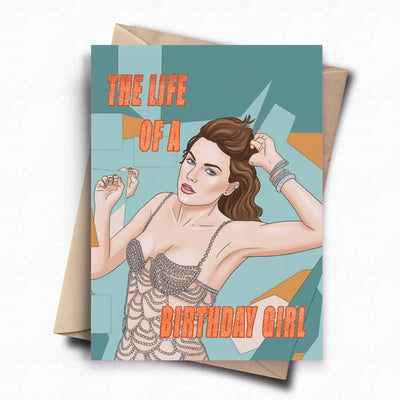 A humorous birthday card featuring a cartoon drawing of Taylor Swift in a bejeweled bodysuit with the words 