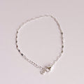 Silver bracelet on a light gray background