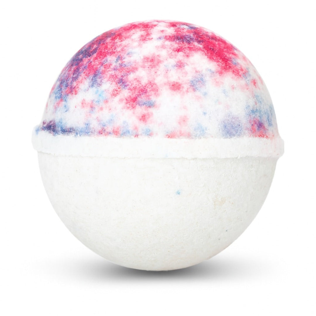 Bath bomb with a colorful top and white bottom on a white background
