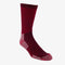 A pair of red socks rolled up and packaged with a label that reads 