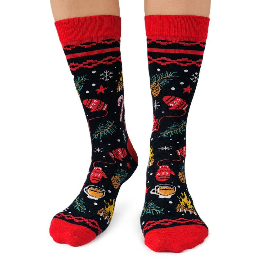 Pair of festive socks with red cuffs and toes on a white background
