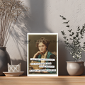 Framed portrait of a woman with text on a shelf with decorative items.