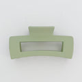 Green hair clip on a white background