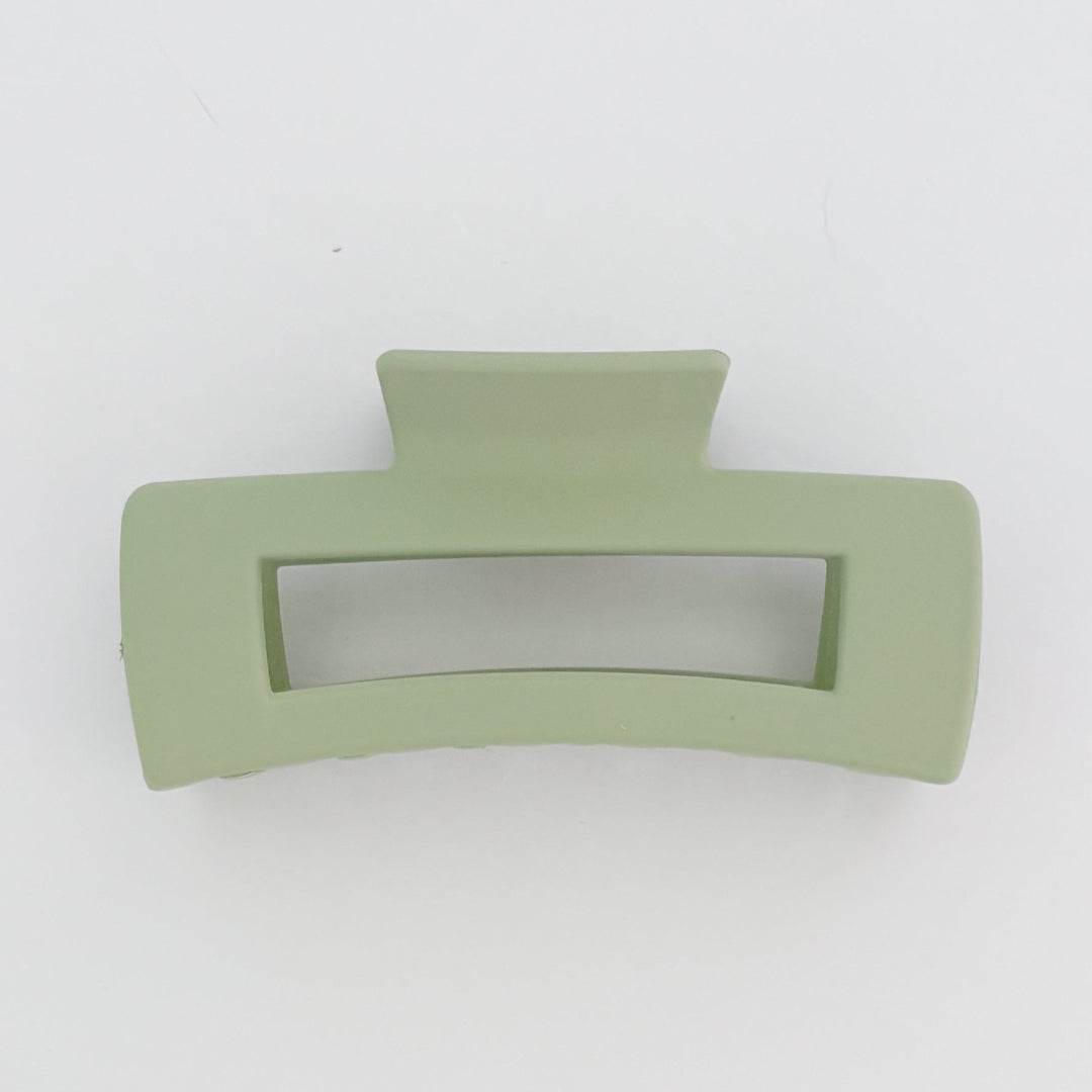 Green hair clip on a white background