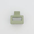 Green hair clip on a white background