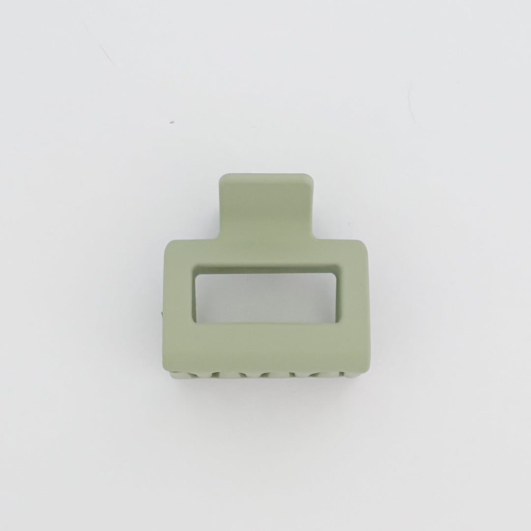 Green hair clip on a white background