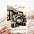 Vintage-style card with a couple in a car labeled 'Just Married' and text about love and life.