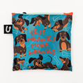 Reusable bag with dachshund pattern and text 'LESS MEANIES MORE WEENIES' on a blue background.
