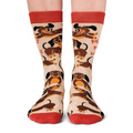Socks with dachshund dog pattern and red accents on a beige background