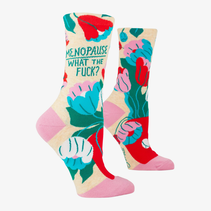 A pair of crew socks with a floral pattern and the phrase 
