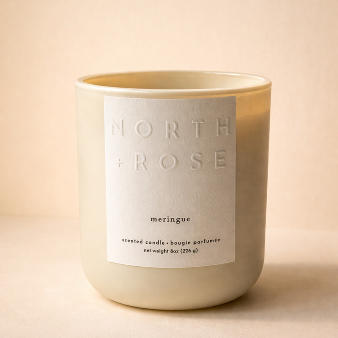 Candle with 'North Rose' label on a beige background