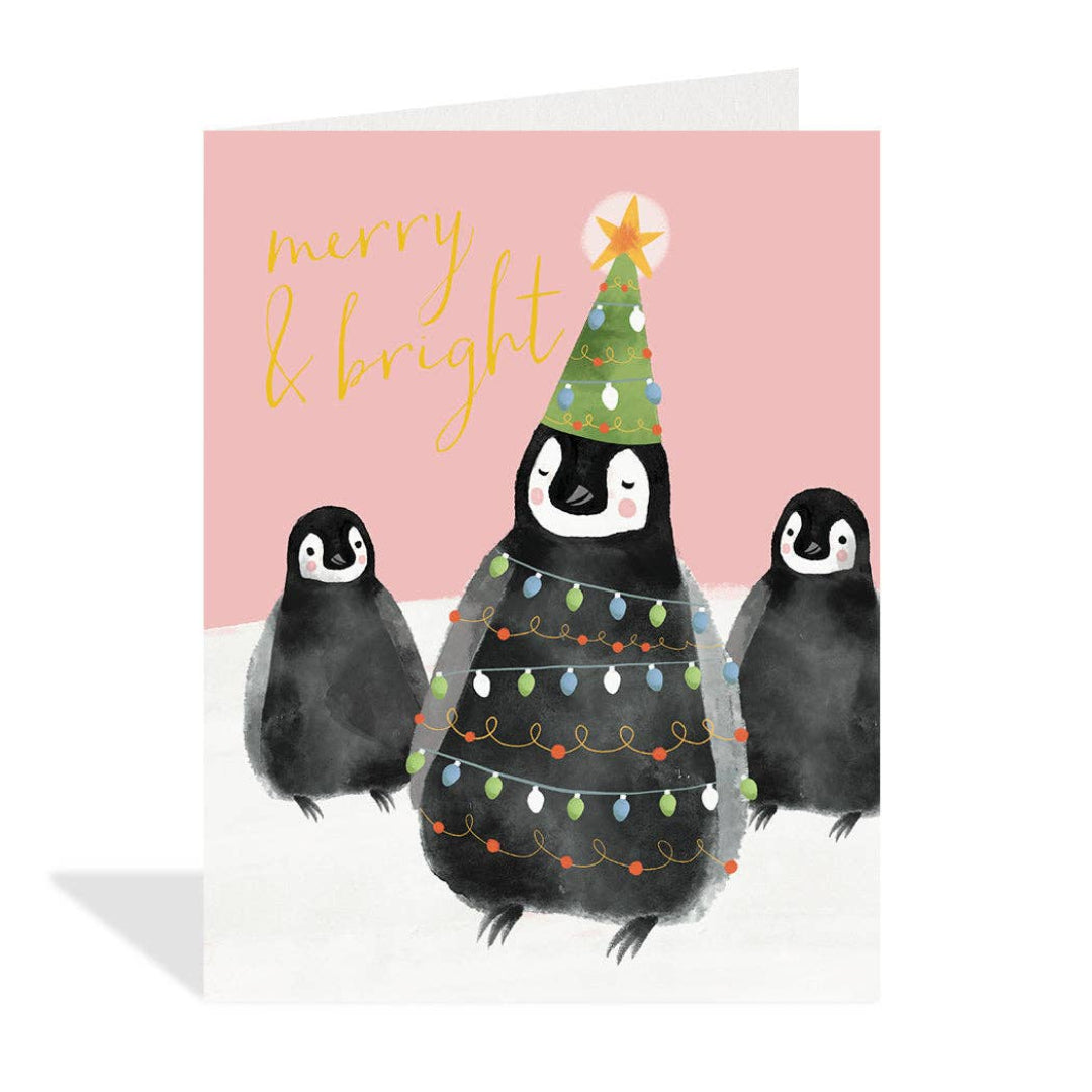Christmas card with penguins and a tree on a pink background