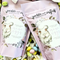A purple bag of Pickle + Myrrh Mini Egg Caramels with a drawing of a bunny and the text 'mini eggs', surrounded by loose mini egg caramels in various pastel colors. These are gourmet, handmade caramels from Merrickville, Ontario, Canada.