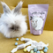 A purple bag of Pickle + Myrrh Mini Egg Caramels with a drawing of a bunny and the text 'mini eggs', surrounded by loose mini egg caramels in various pastel colors. These are gourmet, handmade caramels from Merrickville, Ontario, Canada.