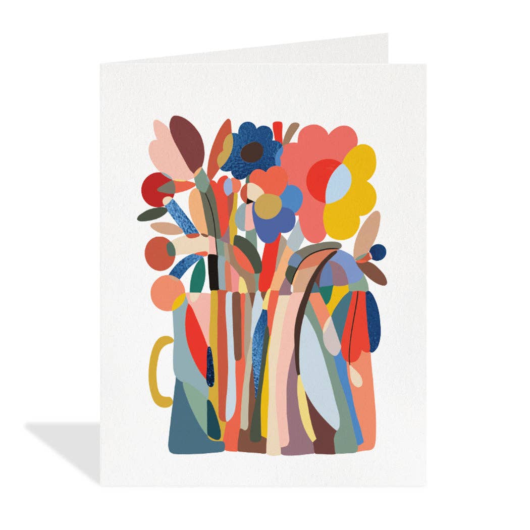White greeting card featuring a colourful and abstract illustration by Marina Castaldo of various stylized flowers and leaves in shades of red, pink, blue, yellow, green, and brown, arranged in a modern vase with a yellow handle. The card is blank inside.